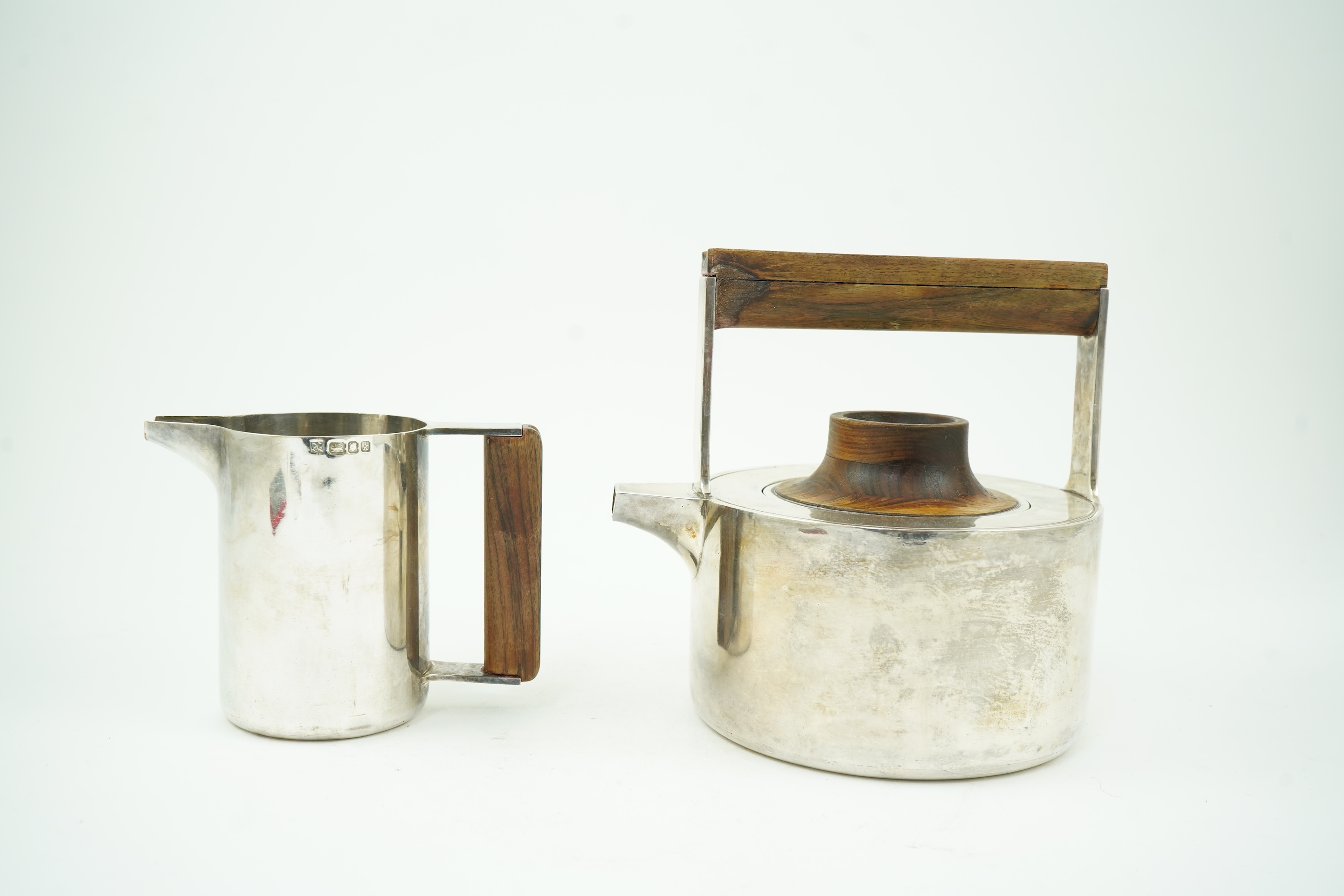 Roy Ridsdale (1942-2020): A silver tea kettle and matching cream jug